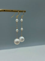 boucles d'oreilles éclat d'ivoir sur présentoir